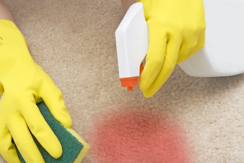 Cleaner preparing carpet cleaning equipment for a scheduled service