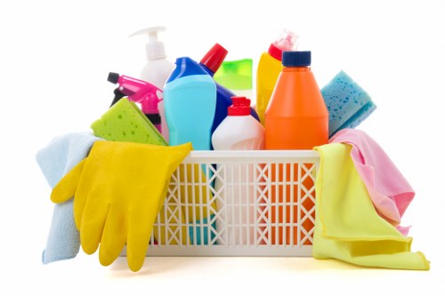 Professional carpet cleaning team working with safety precautions