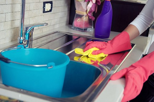 Office cleaning team in Tw1 sanitising desks and shared surfaces
