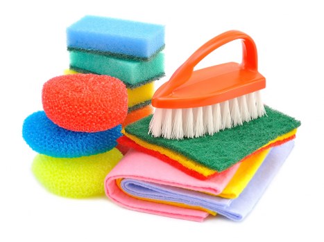 Experienced cleaners in Tw1 working in a bright kitchen and bathroom